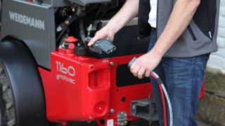 Linde electric forklift truck charging.